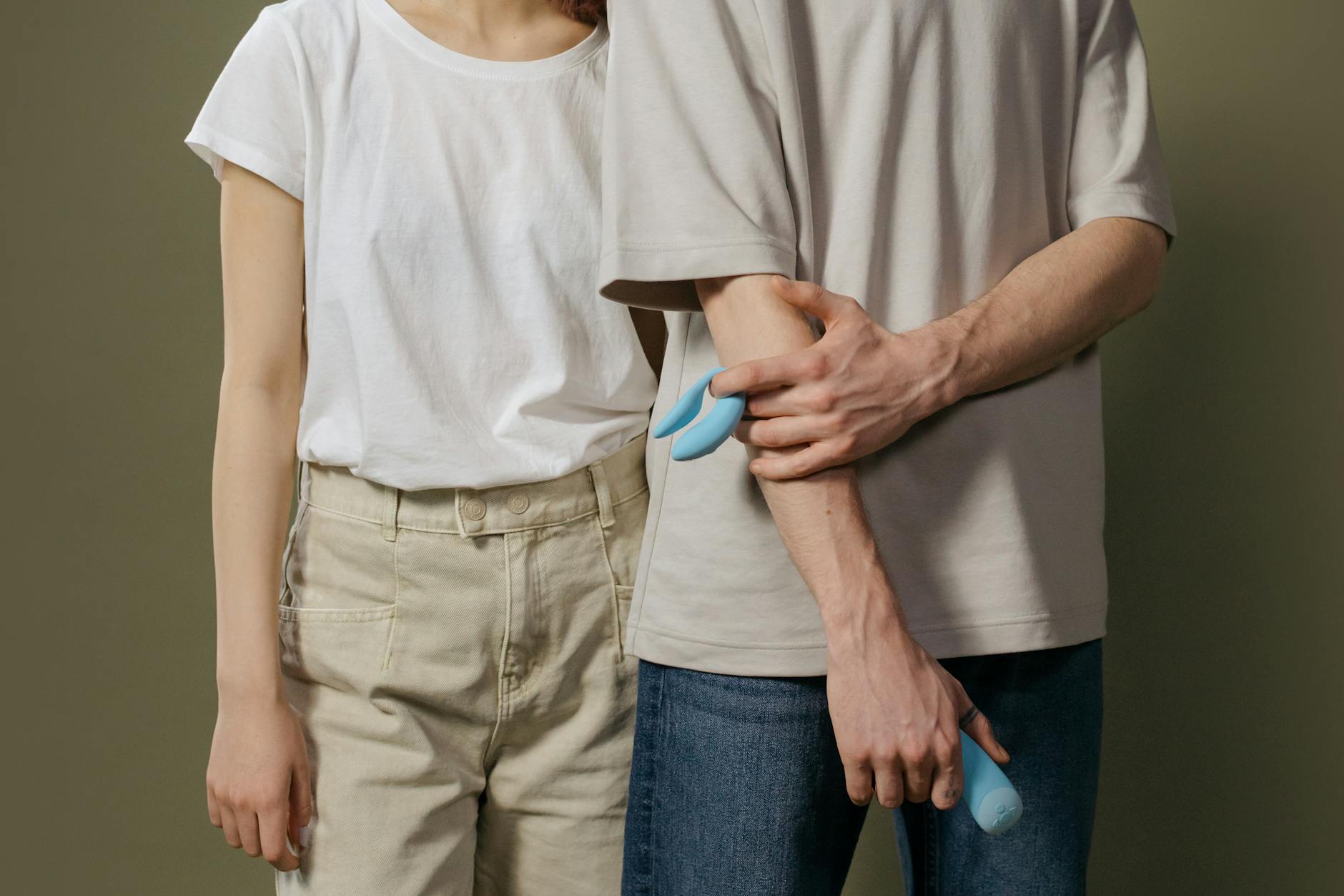A couple standing together indoors, exploring intimacy with modern tools