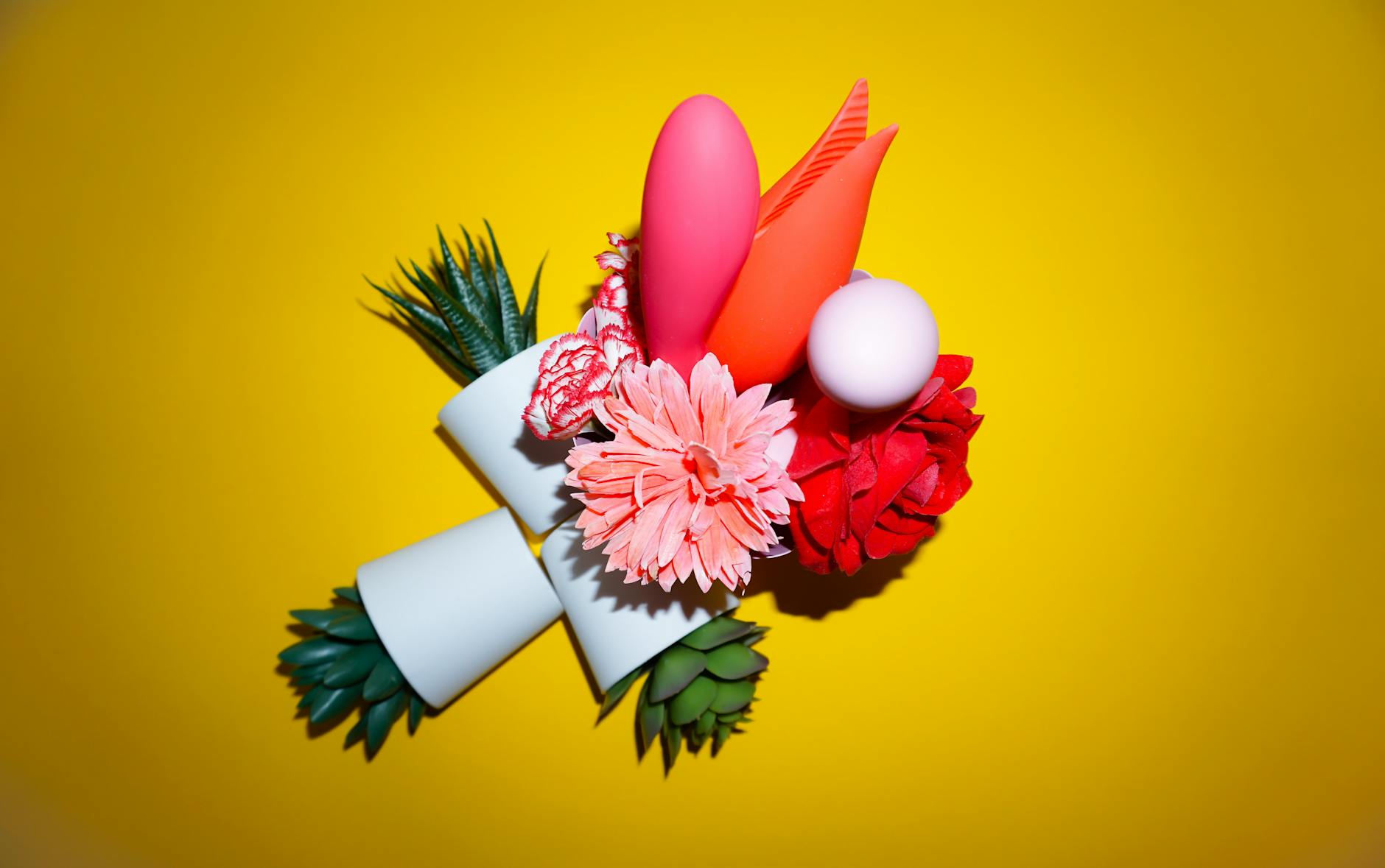 A woman holds a vibrator thoughtfully, representing the journey toward reclaiming pleasure after trauma